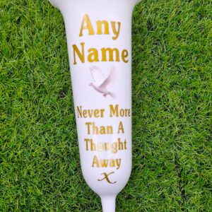 White memorial flower vase with a ground spike.