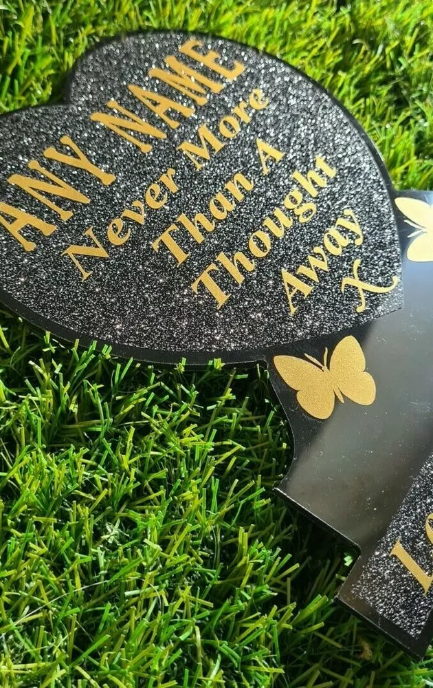 Heart-shaped memorial plaque with remembrance lettering.