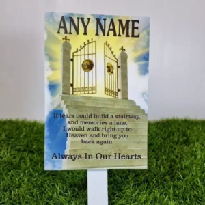 Personalised stone memorial plaque for grave with engraved text and floral motif