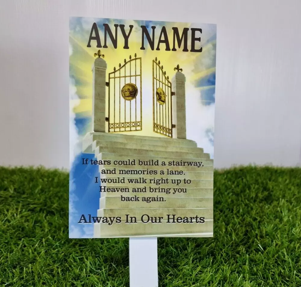 Personalised stone memorial plaque for grave with engraved text and floral motif