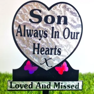 Heart-shaped son memorial plaque with light-refractive purple butterfly