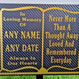 Personalised slate memorial plaque engraved with name and dates for a grave