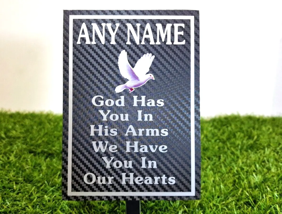 Weatherproof memorial plaque displayed in a garden with custom message