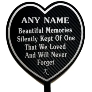 Heart-shaped memorial plaque with remembrance lettering.