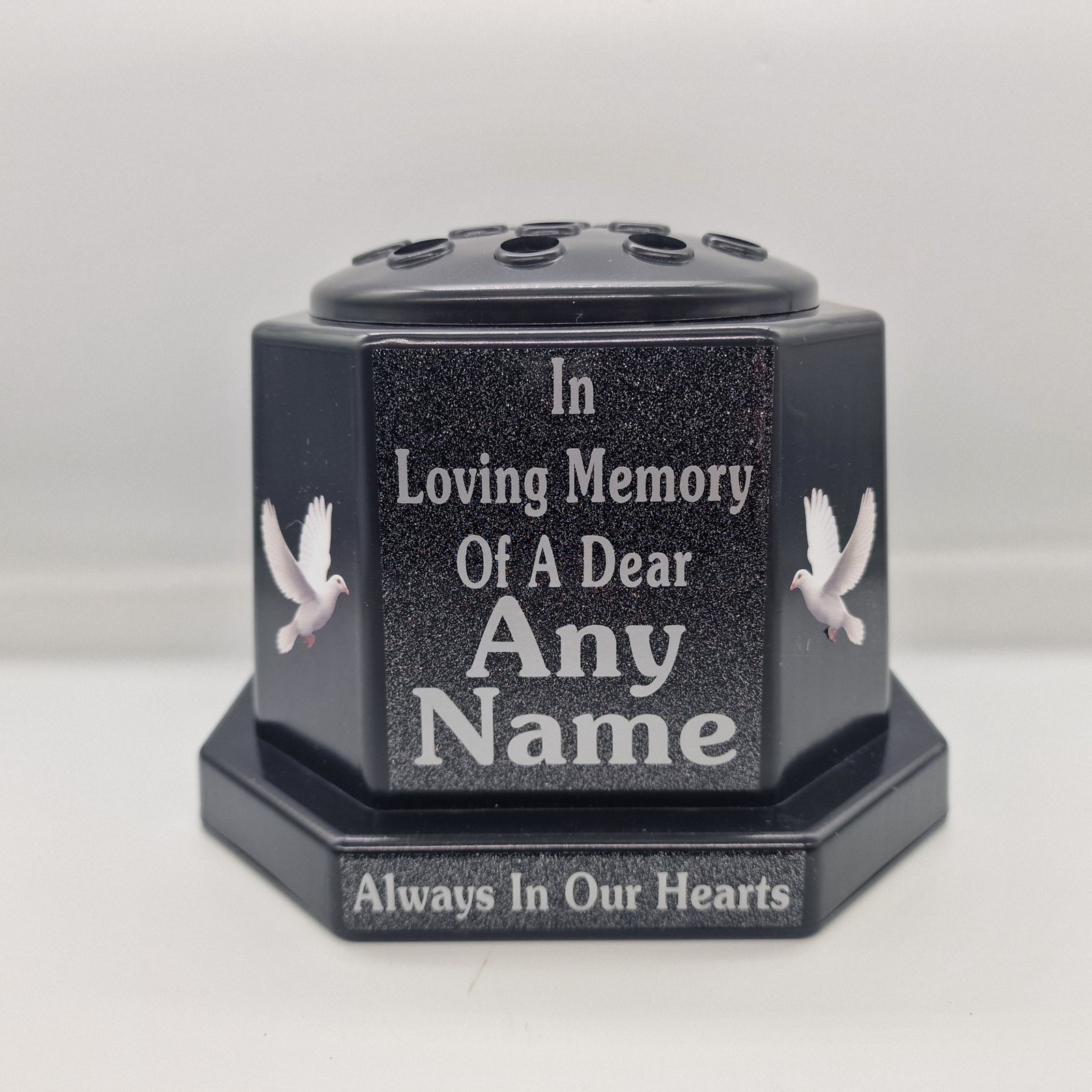 Black memorial rose bowl with white doves, a black flower insert lid and silver name and remembrance lettering.