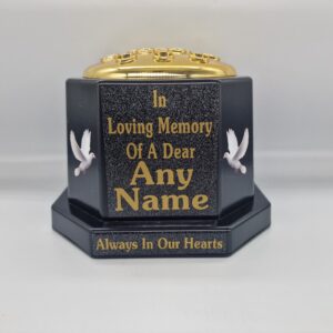Black memorial rose bowl with white doves, a gold flower insert lid and gold name and remembrance lettering.