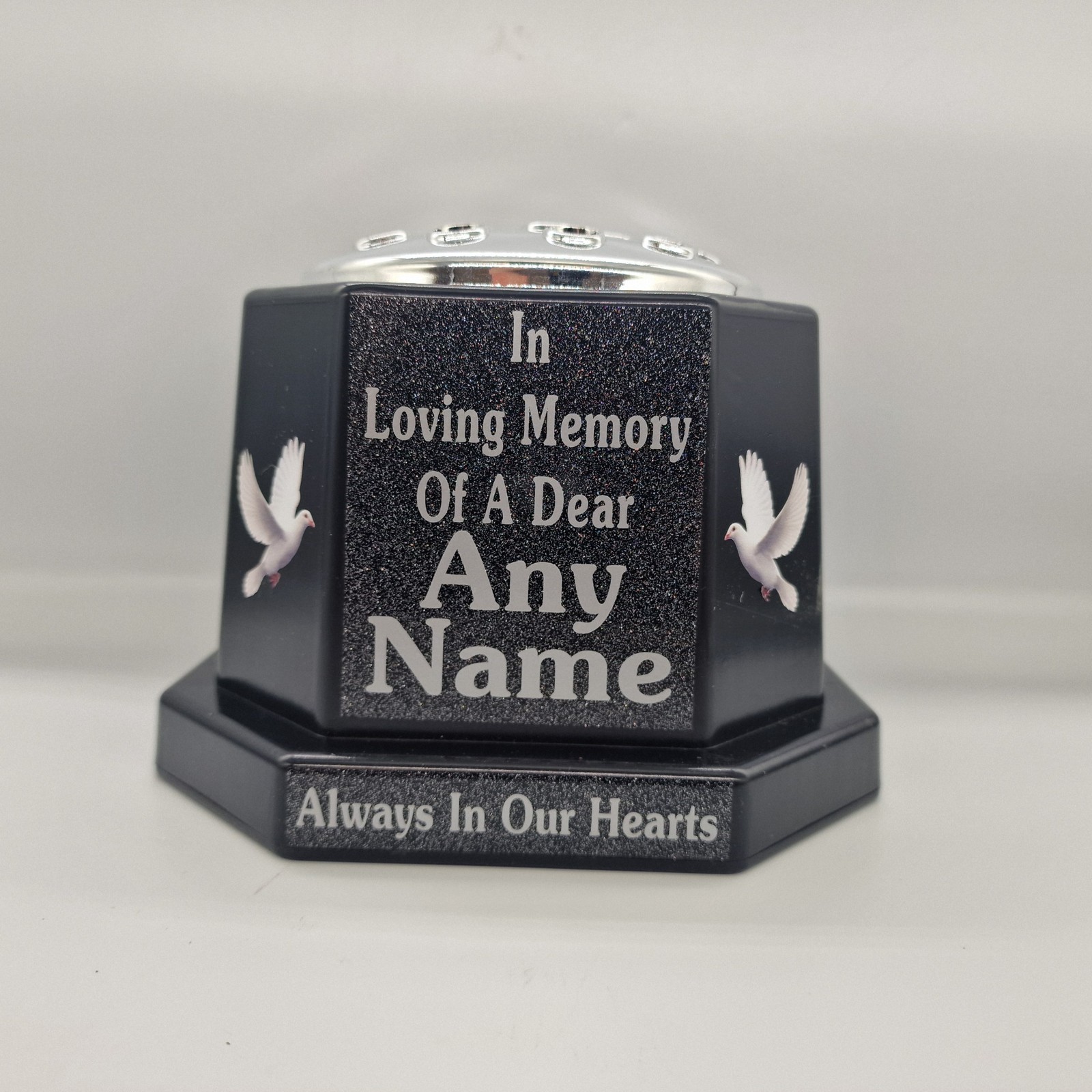 Black memorial rose bowl with white doves, a silver flower insert lid and silver name and remembrance lettering.