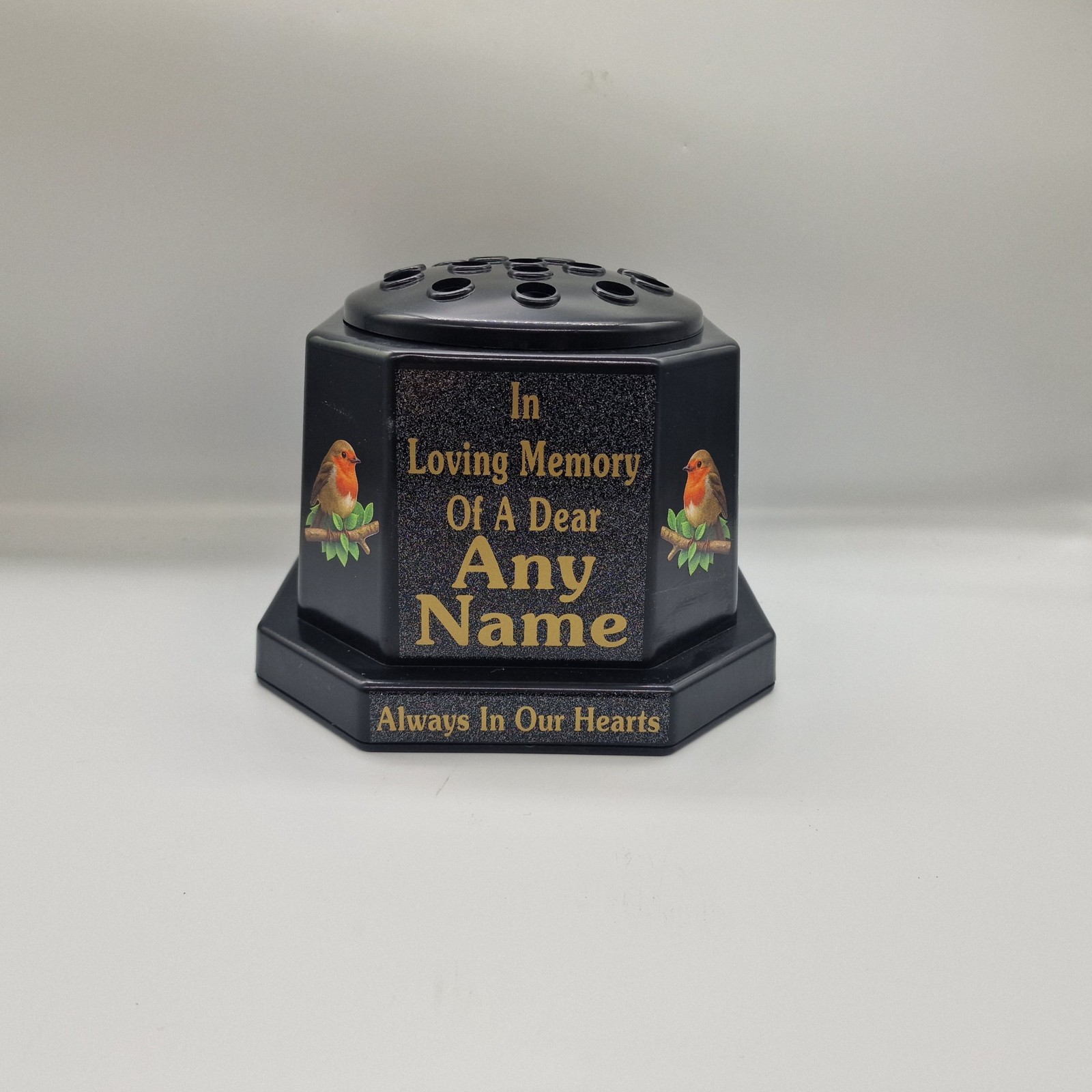 Black memorial rose bowl with two robin illustrations, a black flower insert lid and gold name and remembrance lettering.