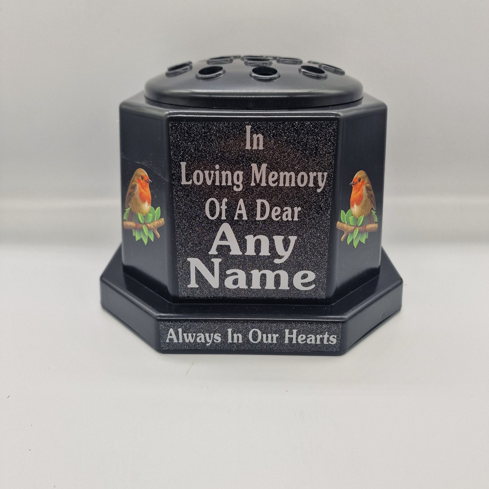 Black memorial rose bowl with two robin illustrations, a black flower insert lid and silver name and remembrance lettering.