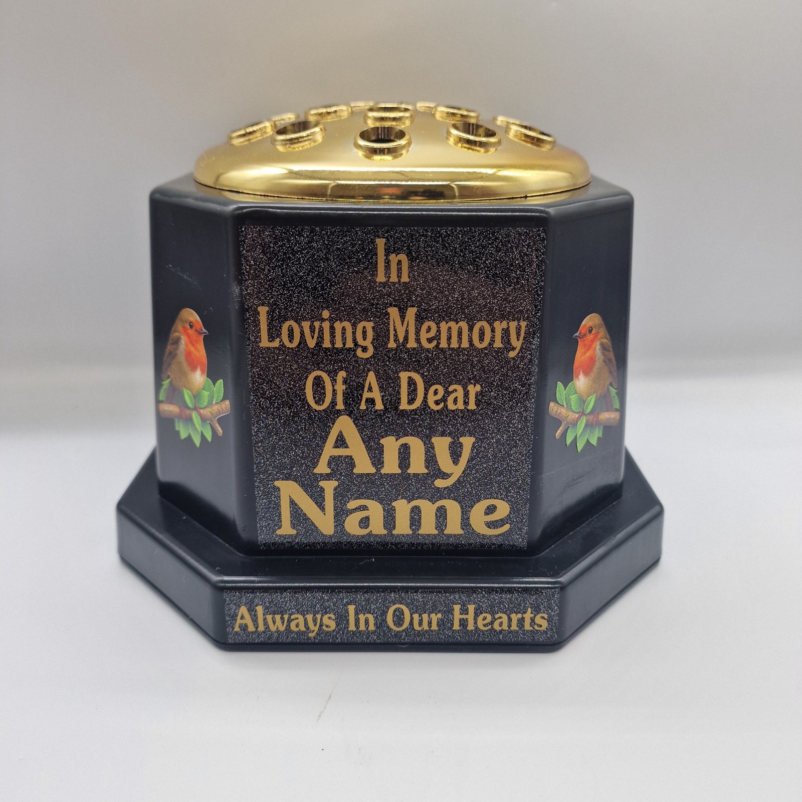 Black memorial rose bowl with two robin illustrations, a gold flower insert lid and gold name and remembrance lettering.