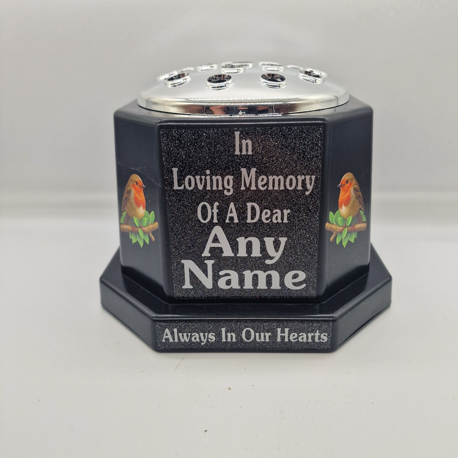 Black memorial rose bowl with two robin illustrations, a silver flower insert lid and silver name and remembrance lettering.